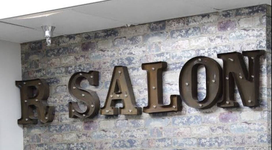 High class beauty salon sign on a rustic brick wall, Clearwater, Florida, US.