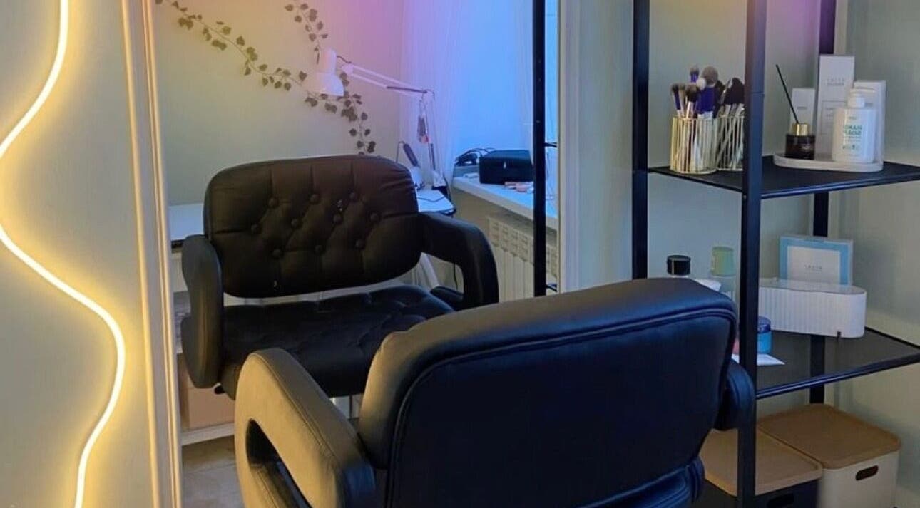 Cozy makeup room at Artistry by Jose Carlos in Houston, Texas, US, featuring elegant decor and plush seating.