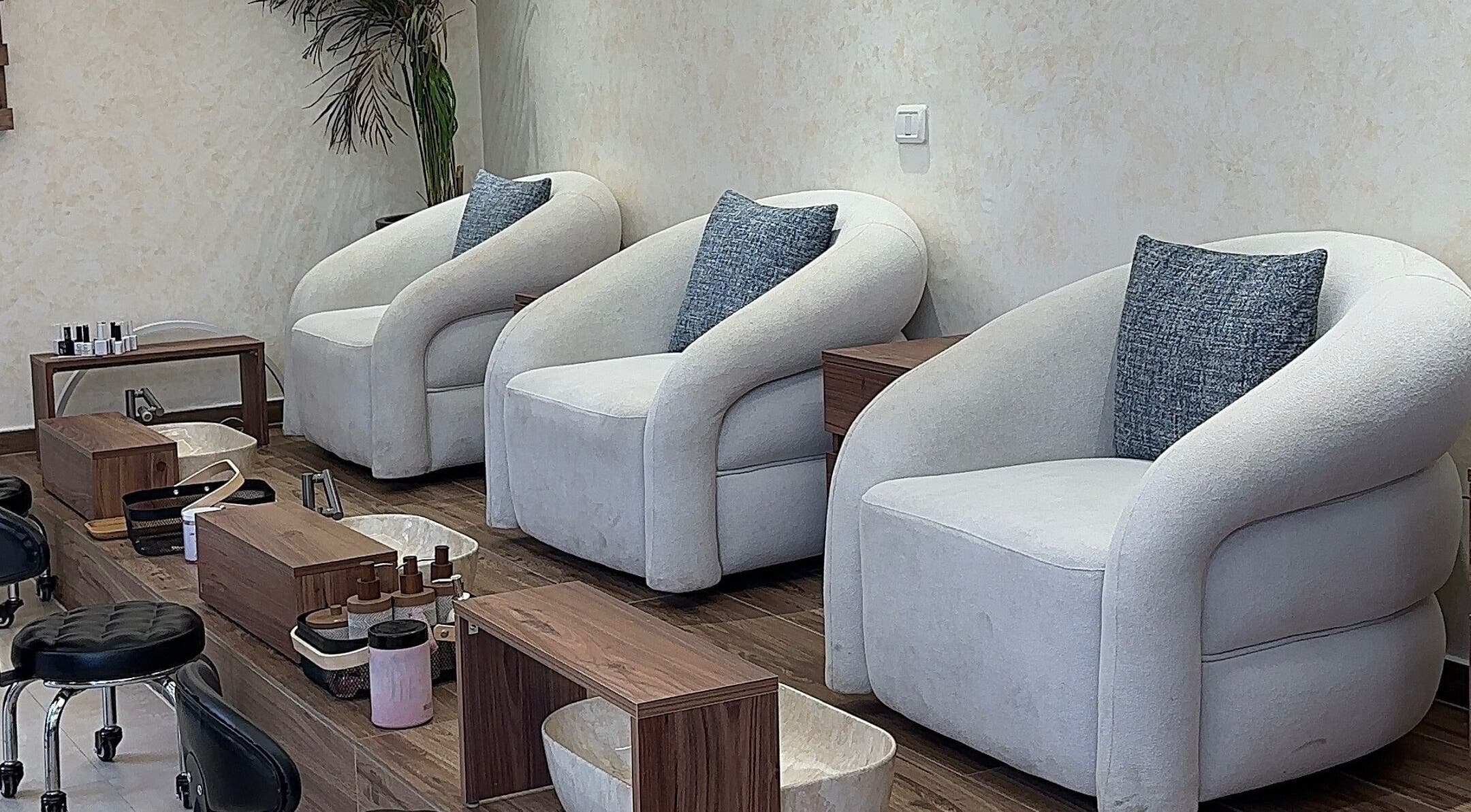 Elegant pedicure chairs at Joelle Beauty Lounge, Bayrut, LB showcasing plush comfort and style.
