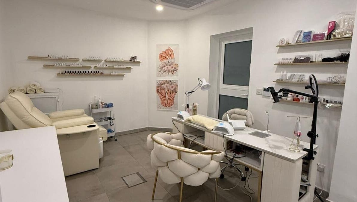 Nail treatment room at Cosmopolitan Beauty Centre, Tas-sliema, MT with cozy seating and elegant decor.