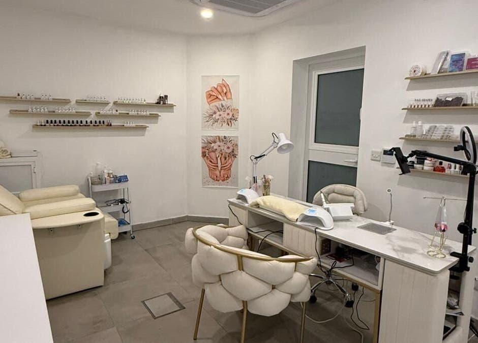 Nail treatment room at Cosmopolitan Beauty Centre, Tas-sliema, MT with cozy seating and elegant decor.