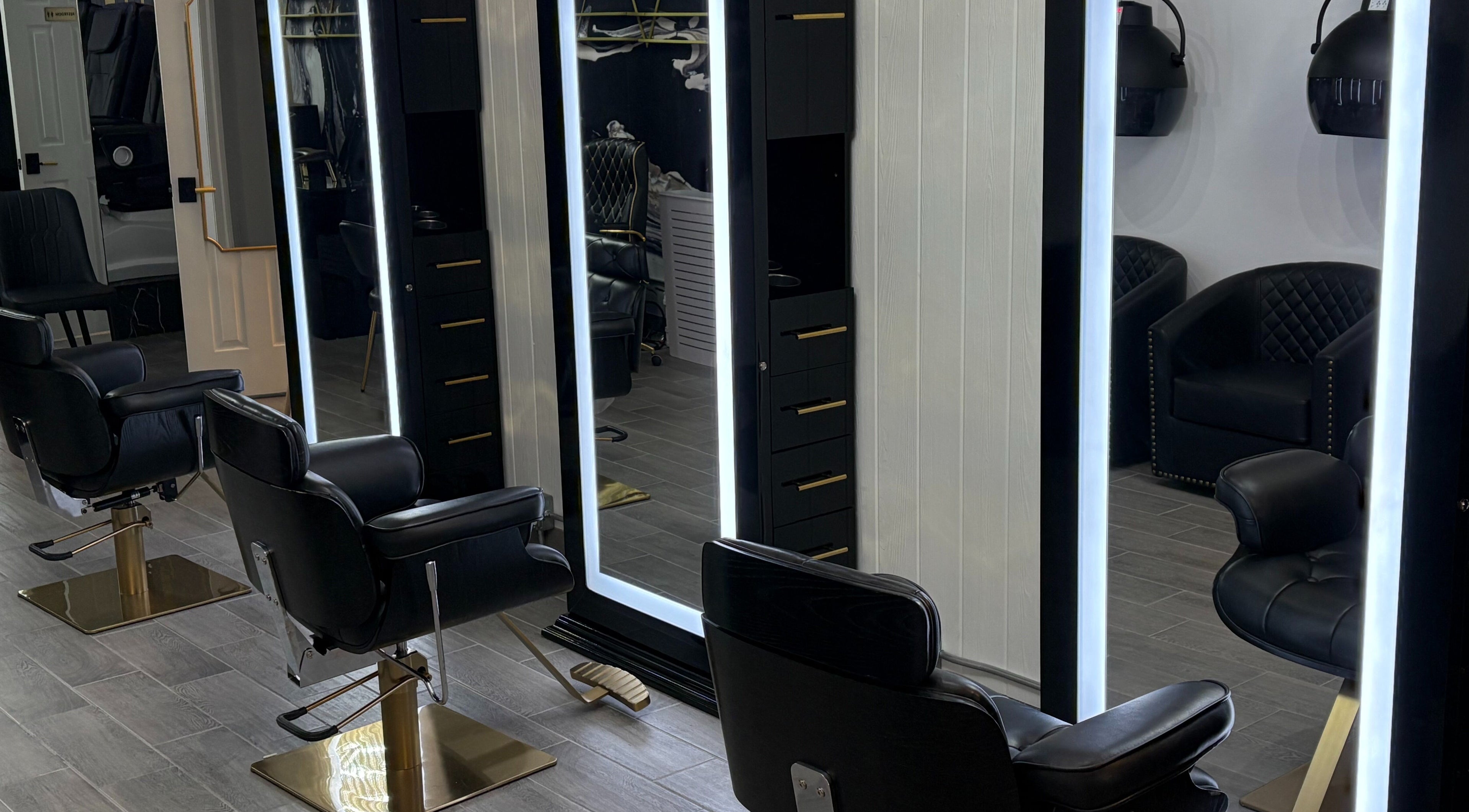 Elegant salon stations at Vanity Me Beauty Bar in New York, New York, US, showcasing modern design.