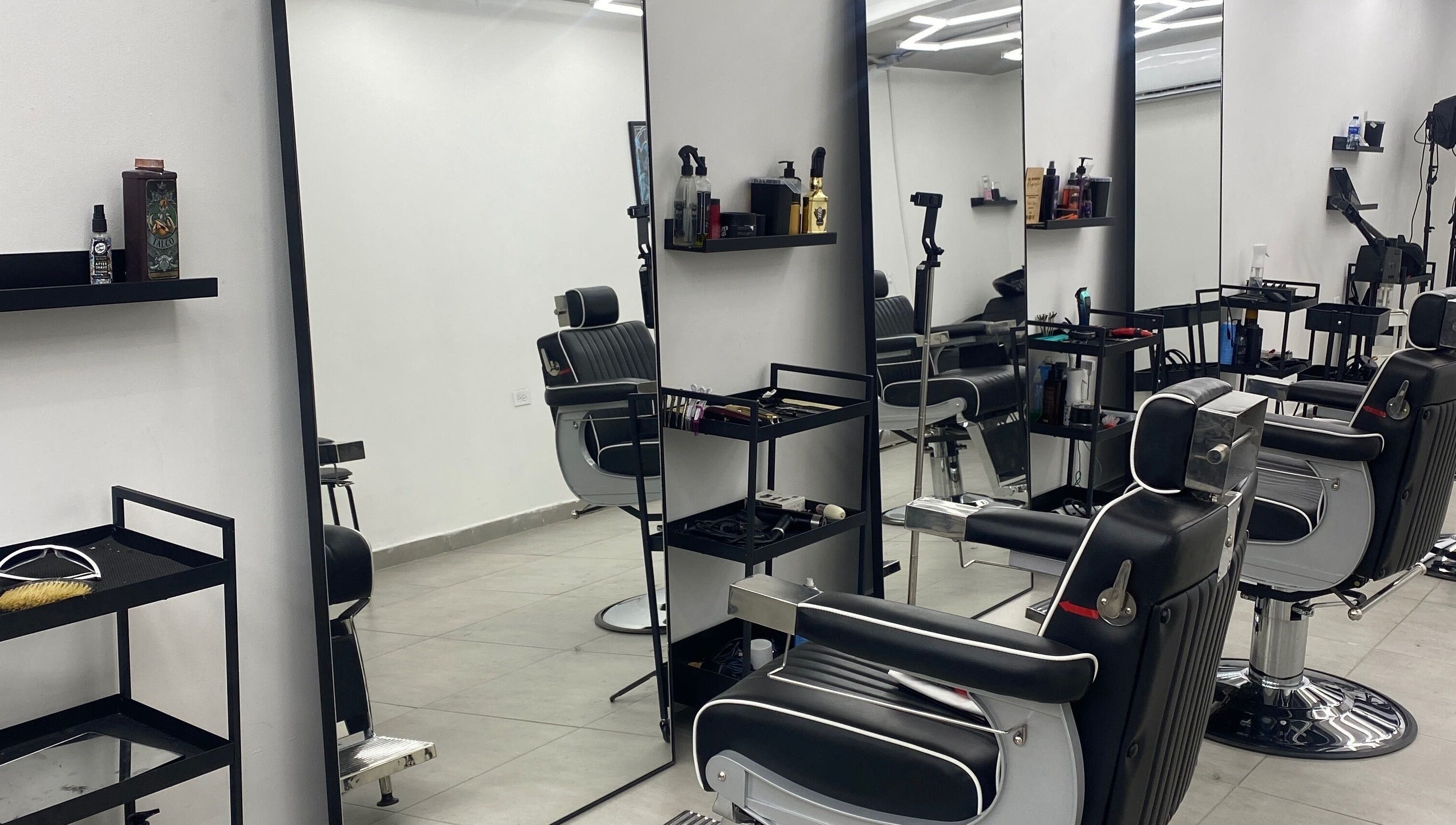 Modern barber chairs at Sebas Monrroy, Envigado, Antioquia, CO showcasing a sleek salon interior.