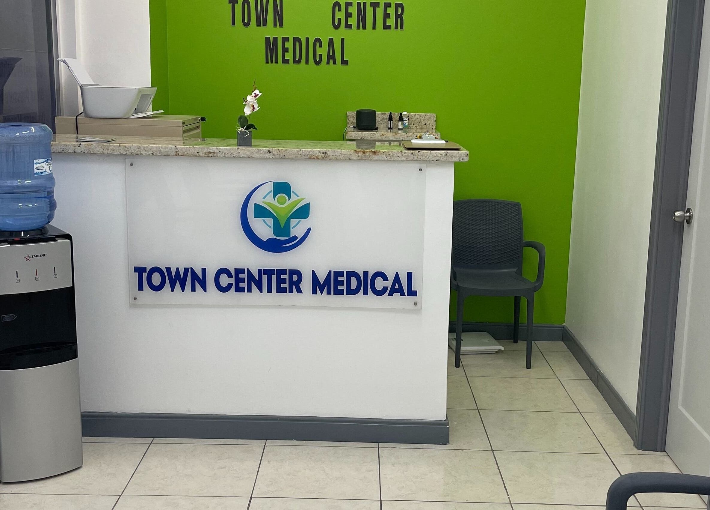 Reception area of Town Center Medical in Saint Ann's Bay, St. Ann Parish, JM with a water cooler.