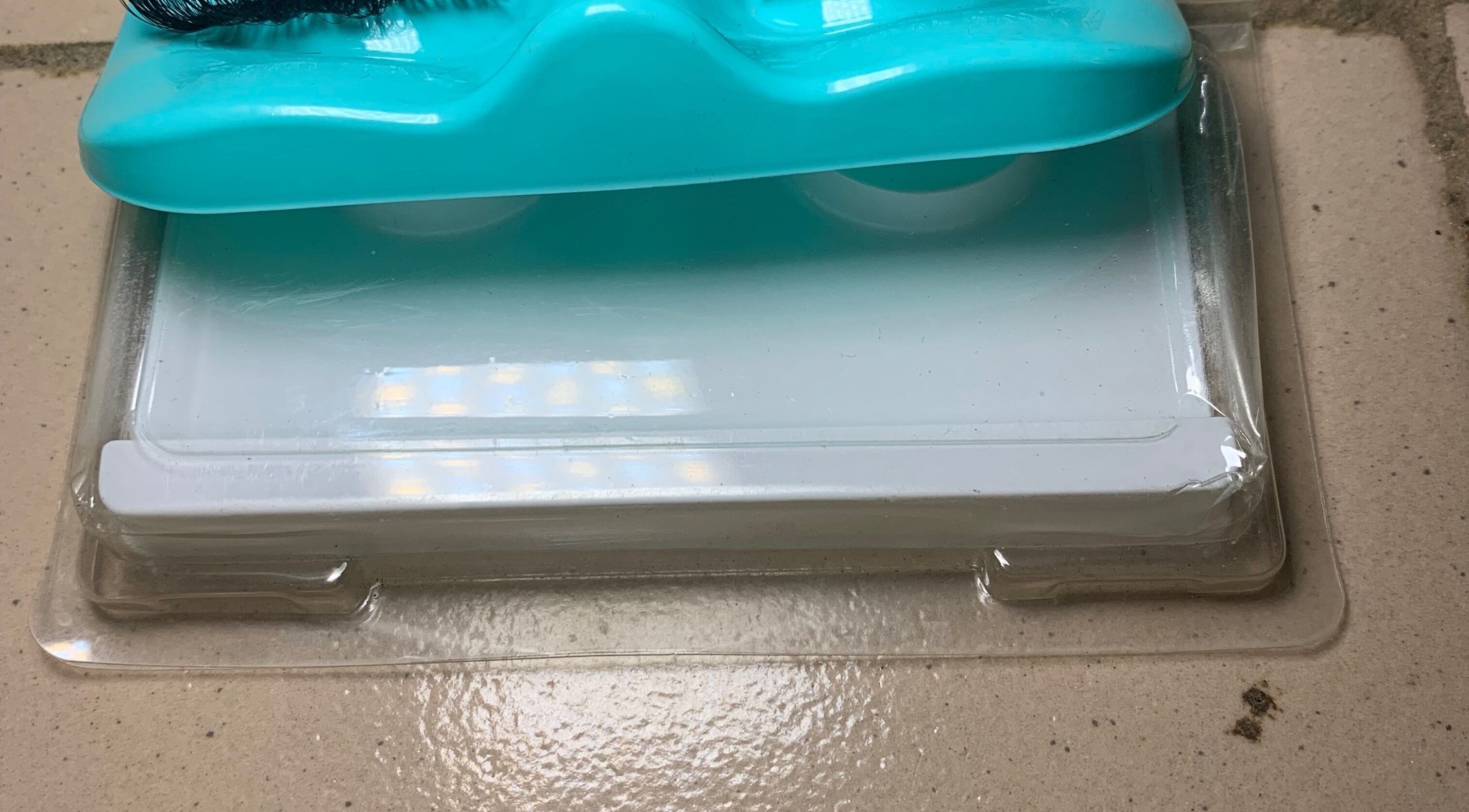 Blue cleaning brush at Jhays Essence, Lagos, Lagos, NG, showcasing sleek packaging.