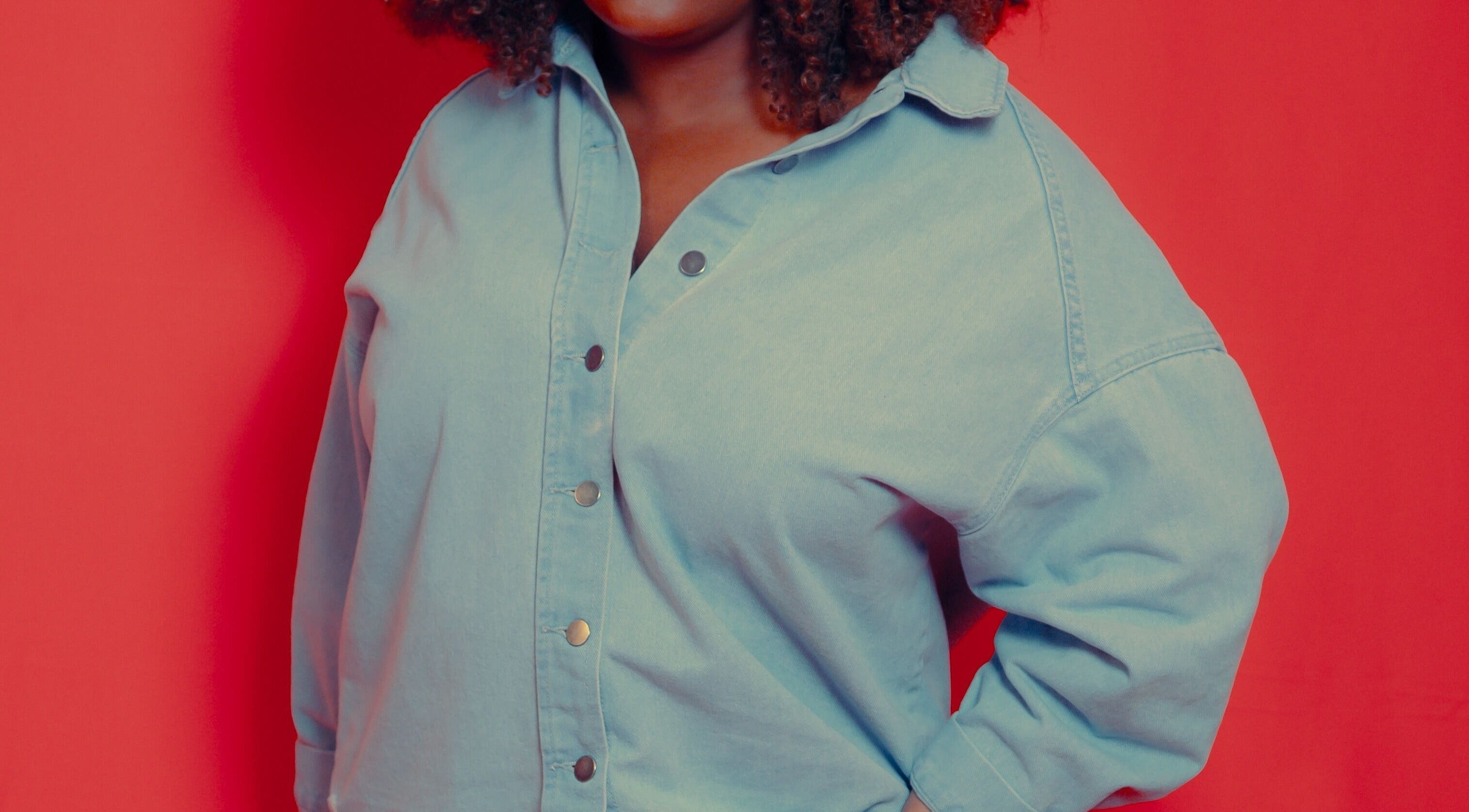 Person in denim shirt posing at Aura Creative Co., Pewaukee, Wisconsin, US.