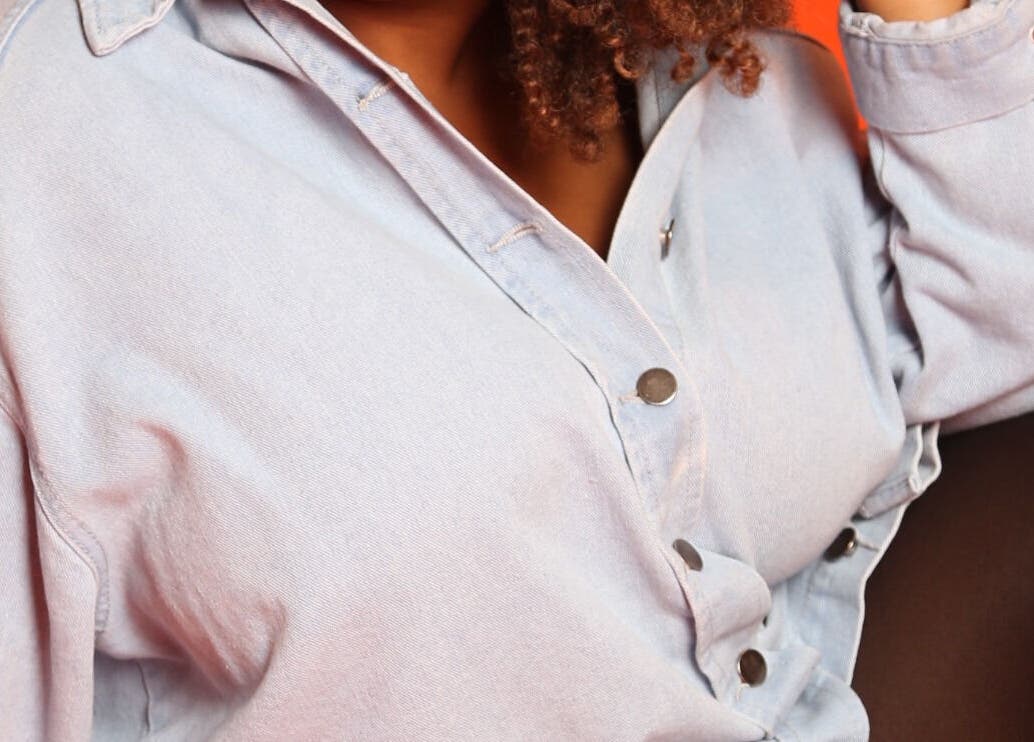 Close-up of a stylish shirt at Aura Creative Co., Pewaukee, Wisconsin, US for beauty and wellness.