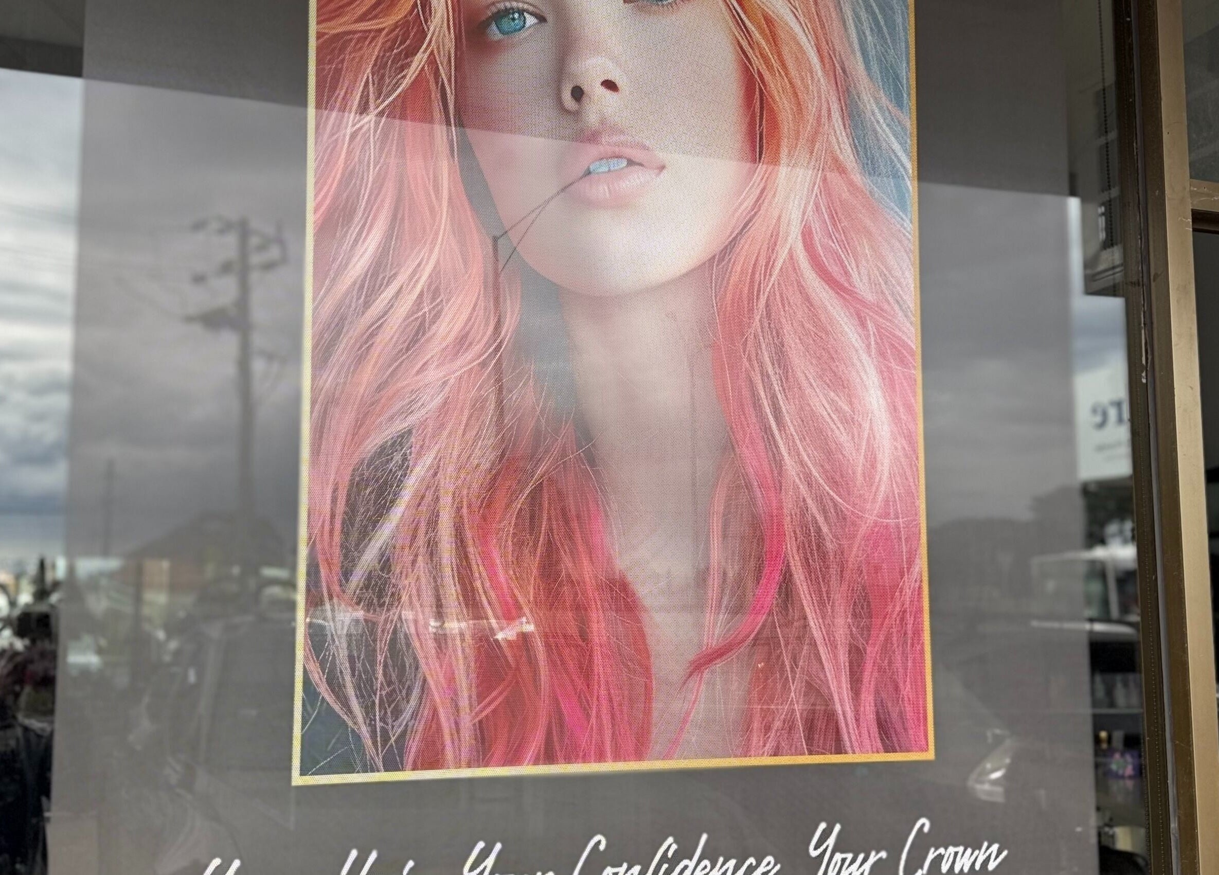Colorful hair poster at Heavenly Hair & Beauty Lounge, Laverton, Victoria, AU showcasing bold hairstyle artistry.