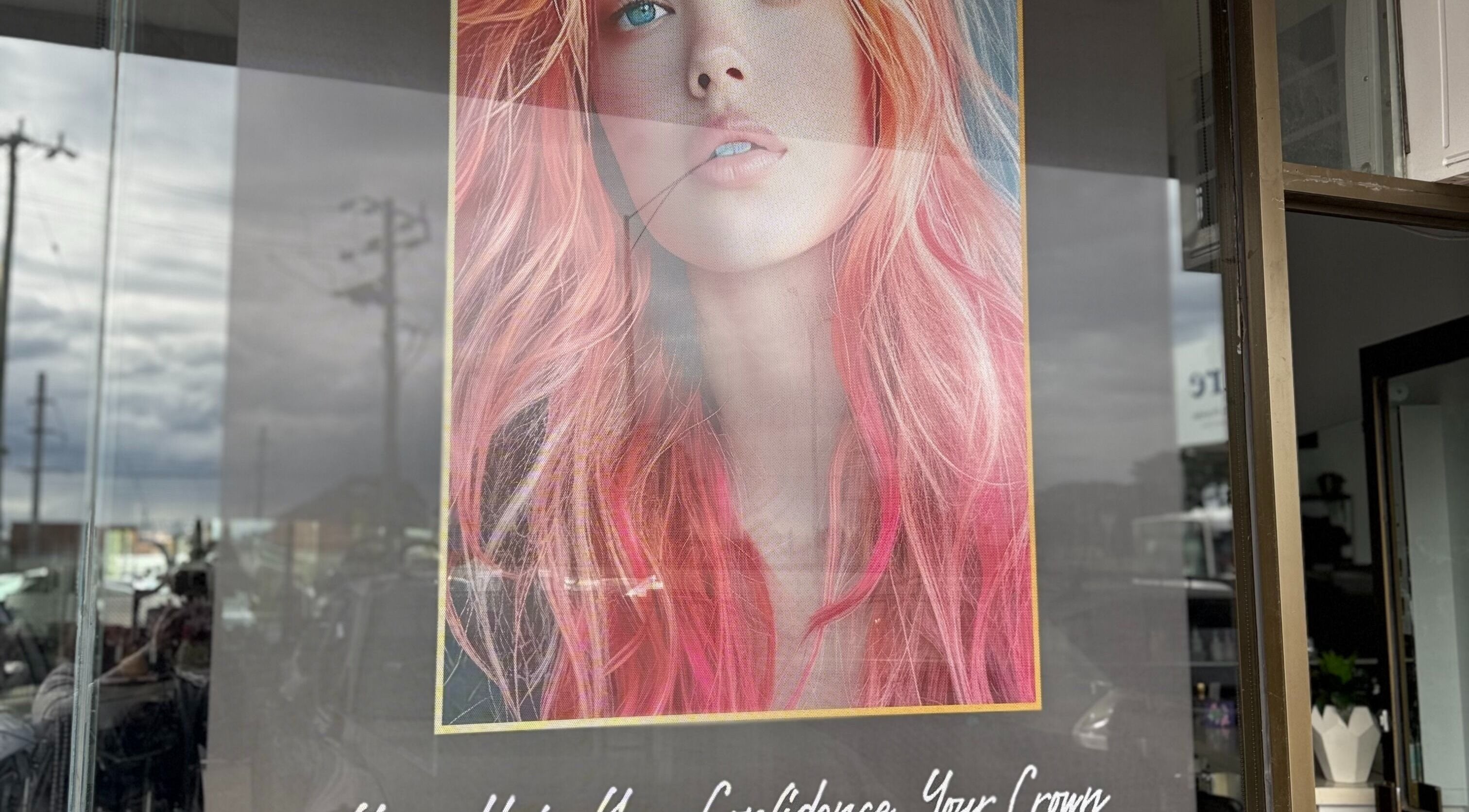 Colorful hair poster at Heavenly Hair & Beauty Lounge, Laverton, Victoria, AU showcasing bold hairstyle artistry.