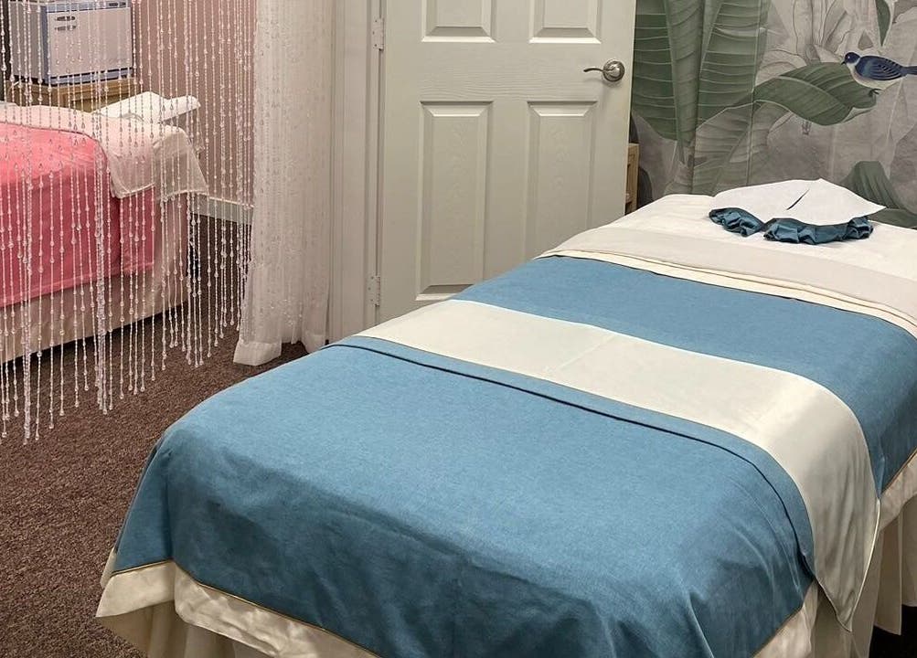 Tranquil massage room at Yuan Massage in Keizer, Oregon, US, featuring elegant decor and peaceful ambiance.