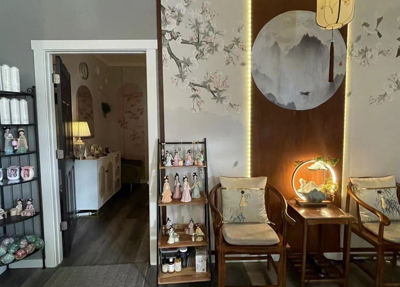 Relaxing corner at Yuan Massage, Keizer, Oregon, US, featuring elegant chairs and artistic decor.