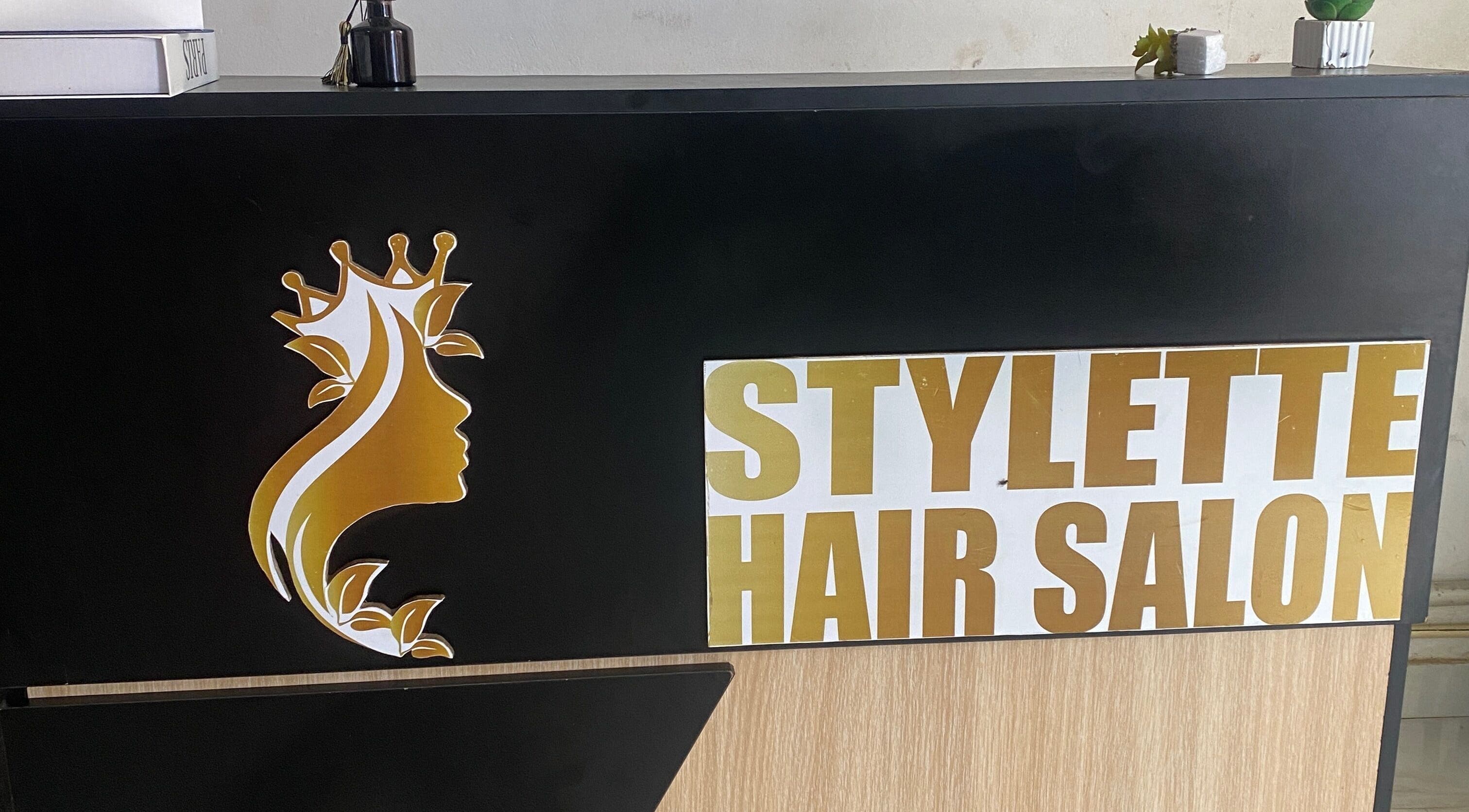 Stylette Hair Salon reception with gold logo at Lusaka, Lusaka Province, ZM.