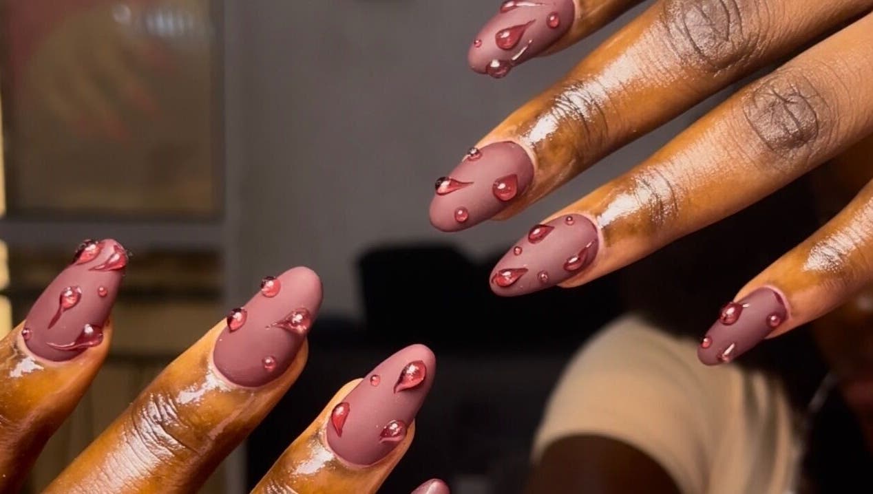 Intricate nail art with glossy pink droplets at The Beys Signature, Lagos, Lagos, NG.