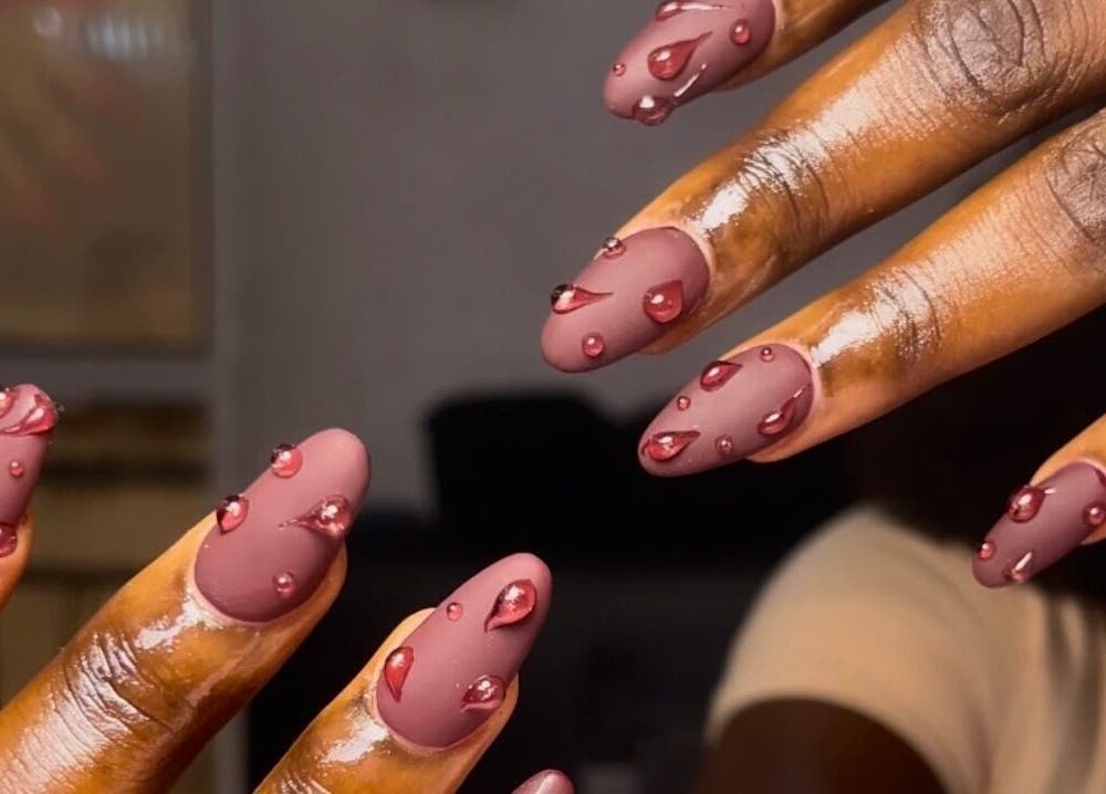 Intricate nail art with glossy pink droplets at The Beys Signature, Lagos, Lagos, NG.