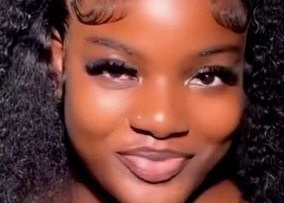 A woman with curly hair and radiant skin at The Beys Signature, Lagos, Lagos, NG.