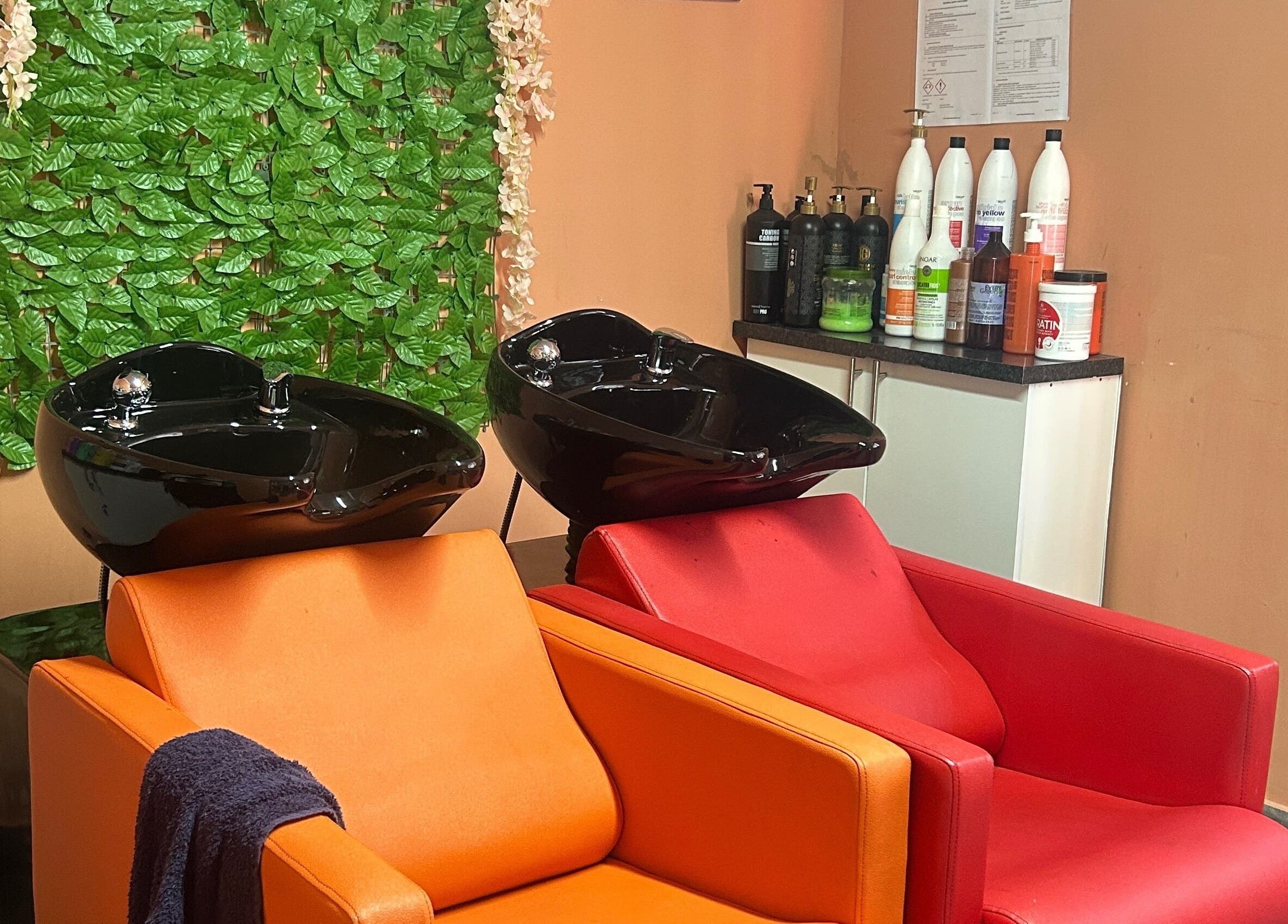 Modern hair wash stations at Excelle Hair Clinic And Training, Cape Town, Western Cape, ZA.