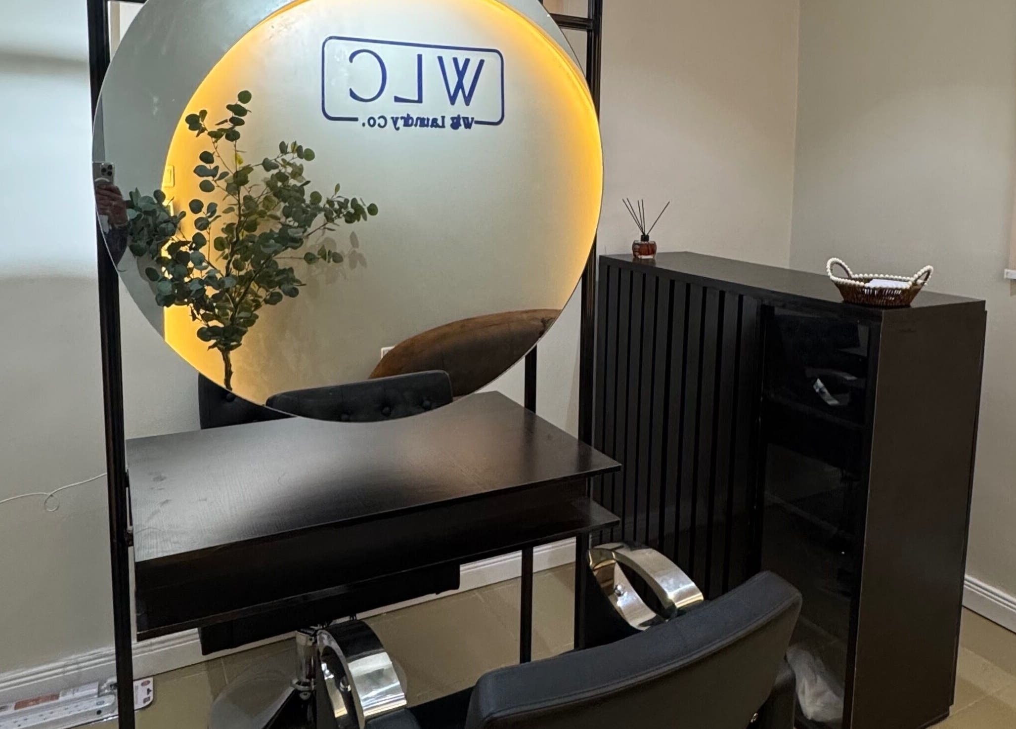 Modern salon setup with mirror and plants at Wig Laundry Company, Lagos, Lagos, NG.