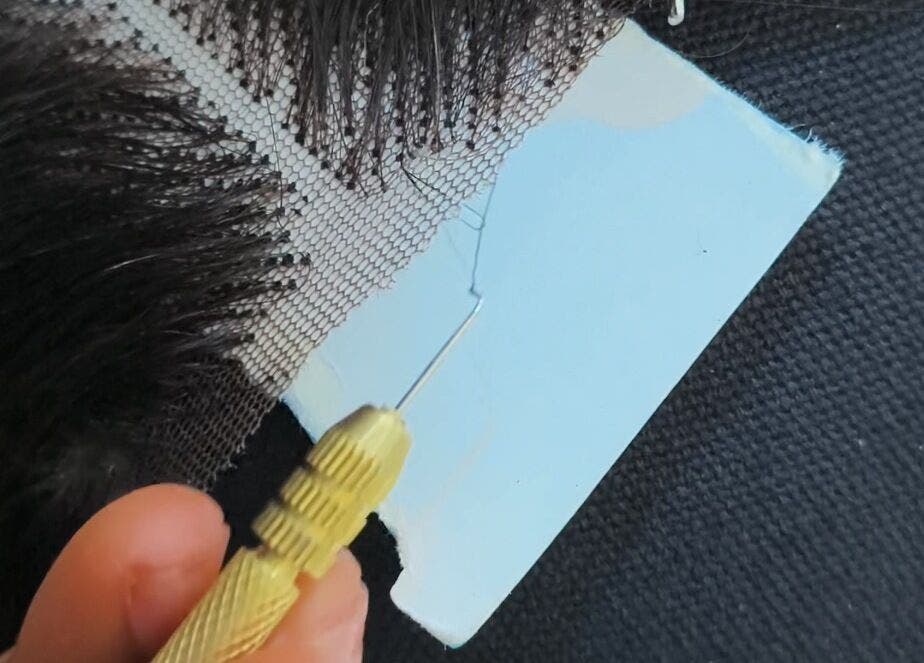 Detailed view of wig crafting process at Wig Laundry Company, Lagos, Lagos, NG.