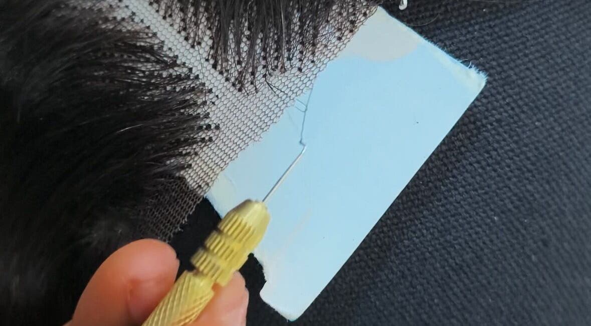 Detailed view of wig crafting process at Wig Laundry Company, Lagos, Lagos, NG.