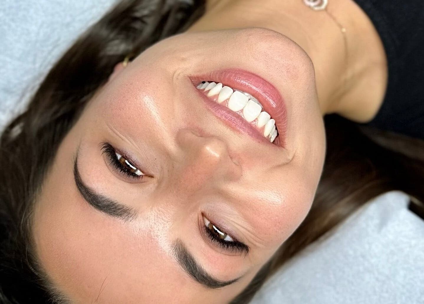 Close-up of a smiling client at Voilà Collective, Val De Vie Winelands Lifestyle Estate, Western Cape, ZA.