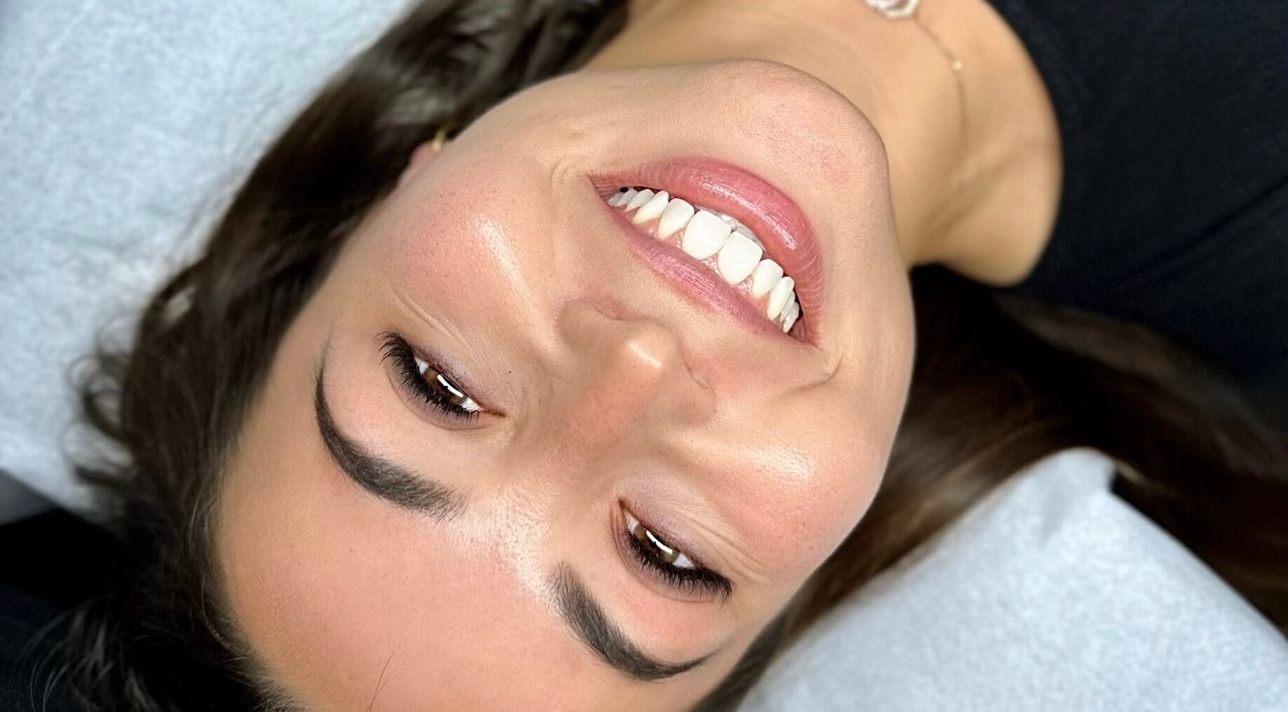 Close-up of a smiling client at Voilà Collective, Val De Vie Winelands Lifestyle Estate, Western Cape, ZA.