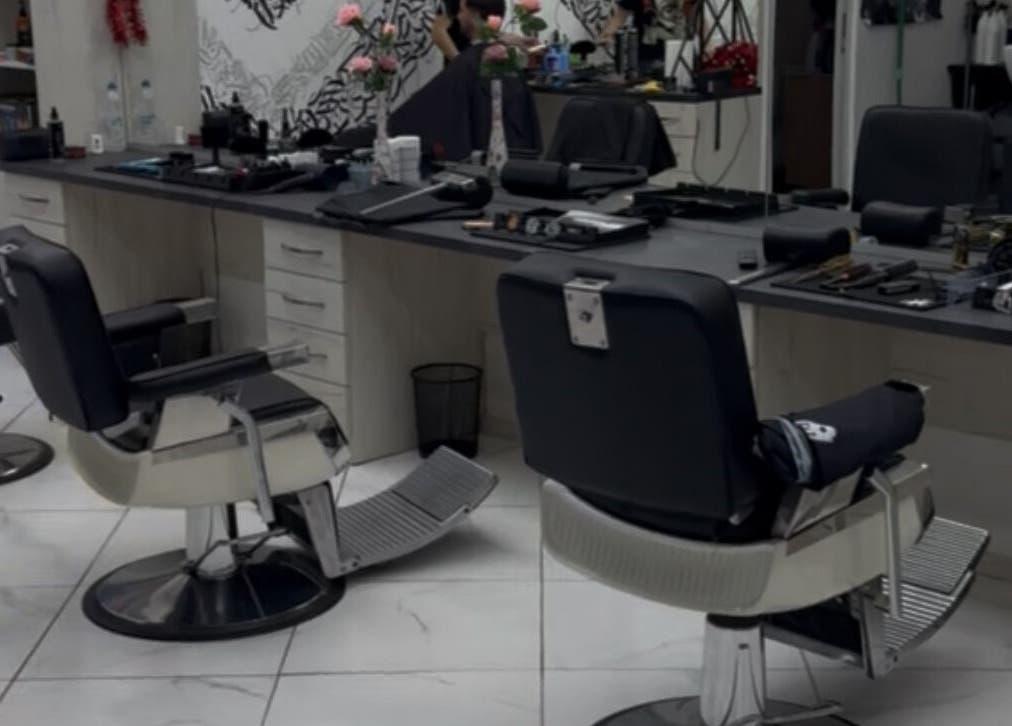 Modern salon setup at Bonnie and Clyde Ruse, Ruse, BG showcasing sleek chairs and styling tools.