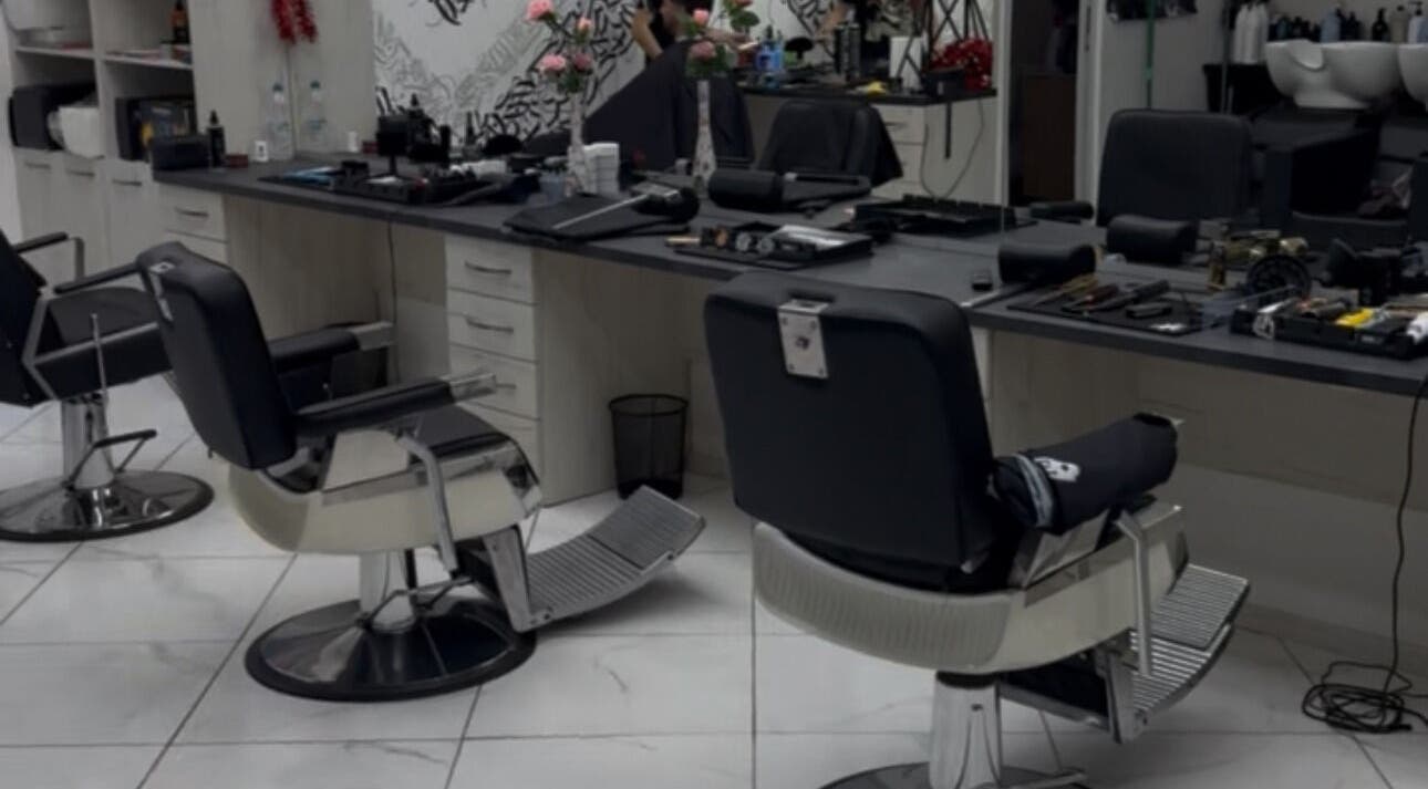 Modern salon setup at Bonnie and Clyde Ruse, Ruse, BG showcasing sleek chairs and styling tools.
