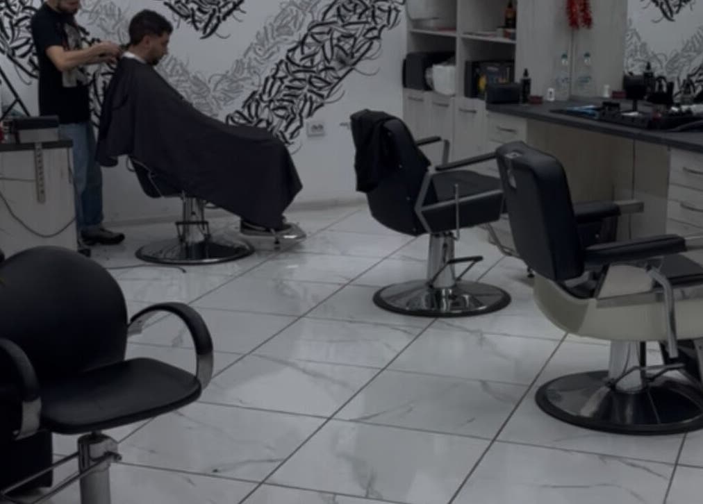 Modern salon interior at Bonnie and Clyde Ruse, Ruse, Ruse, BG with hairdresser and client.