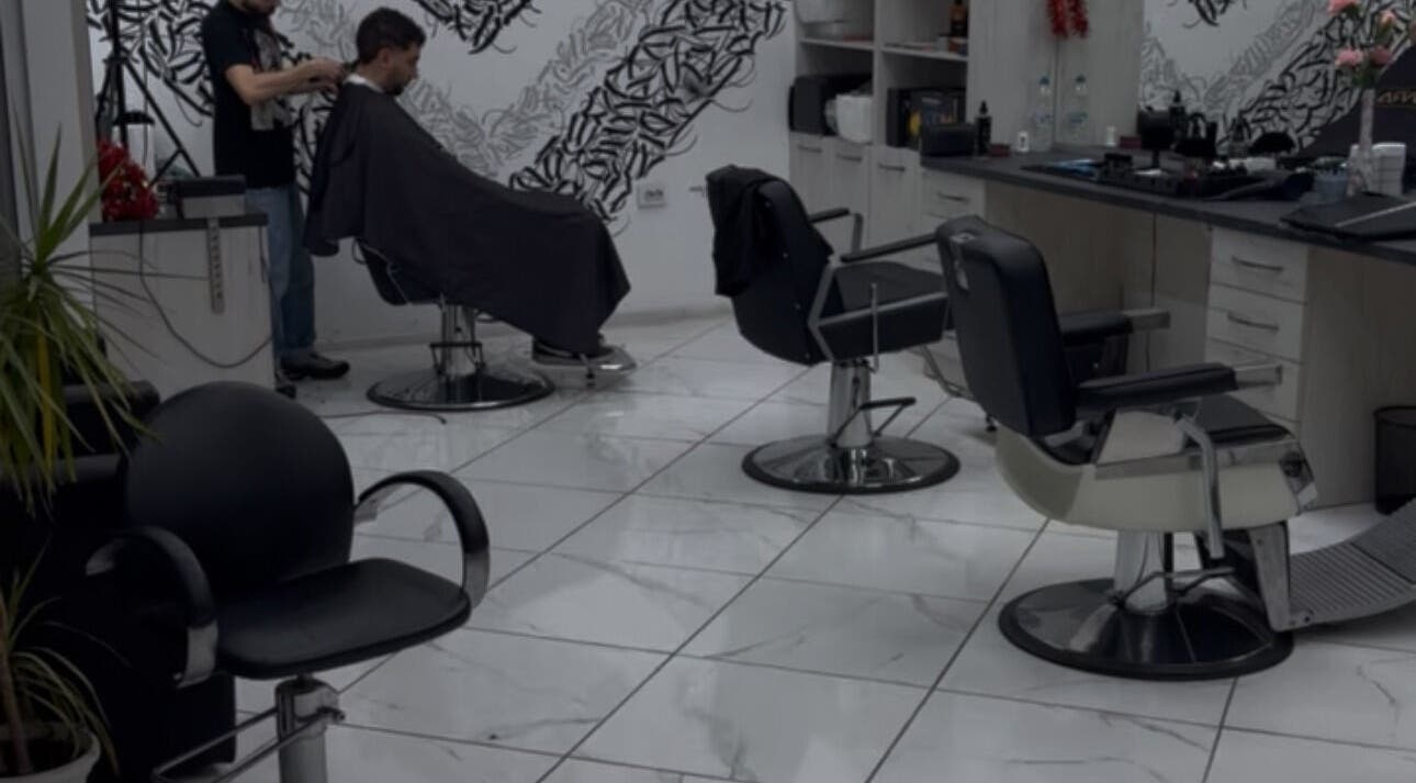 Modern salon interior at Bonnie and Clyde Ruse, Ruse, Ruse, BG with hairdresser and client.