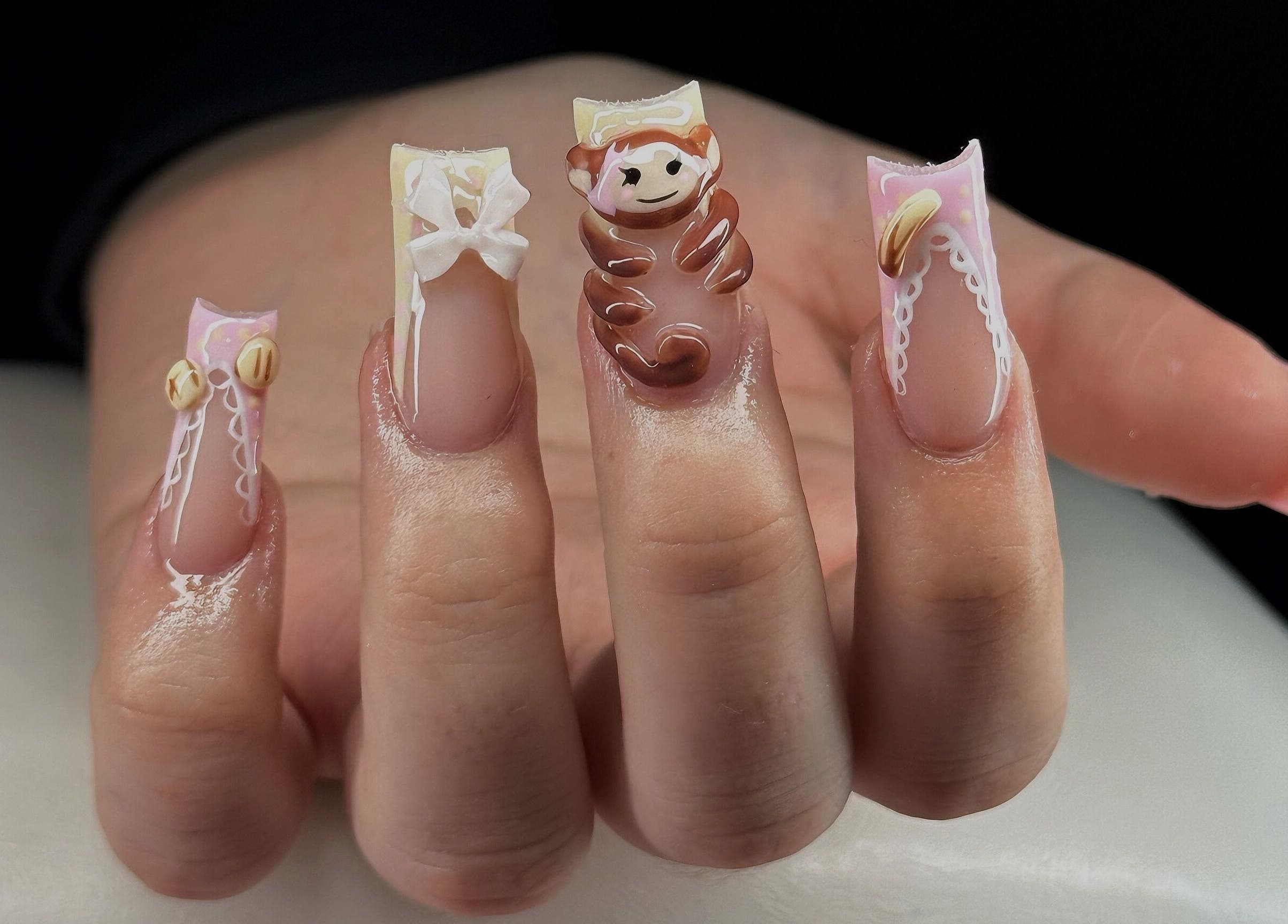 Unique nail designs at Leasnailhub in Peterborough, England, GB, showcasing playful character art.