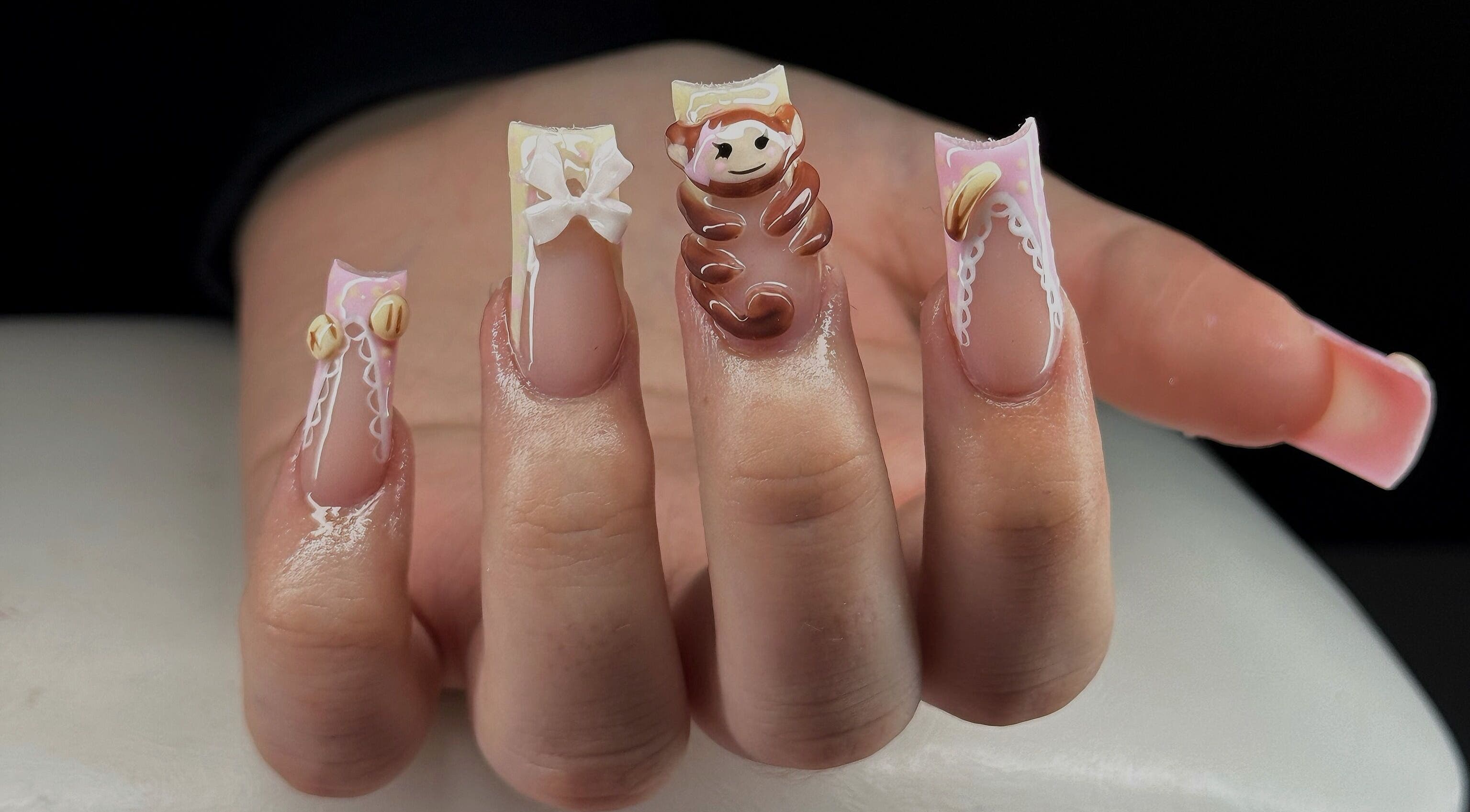 Unique nail designs at Leasnailhub in Peterborough, England, GB, showcasing playful character art.