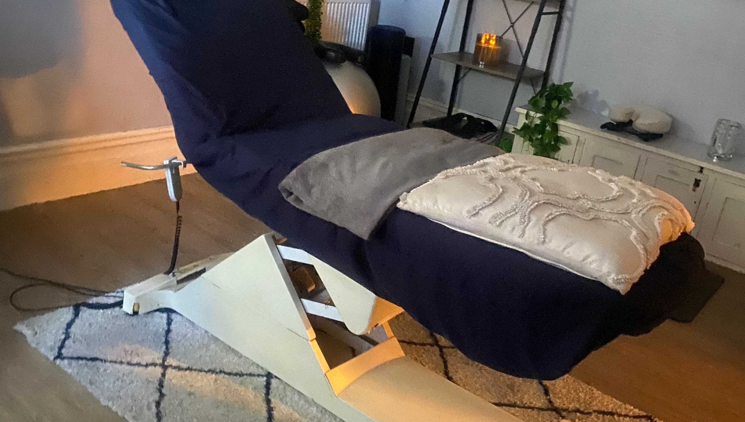 Relaxing massage chair in a cozy room at 1stclass Massage, Sebastopol, Wales, GB.