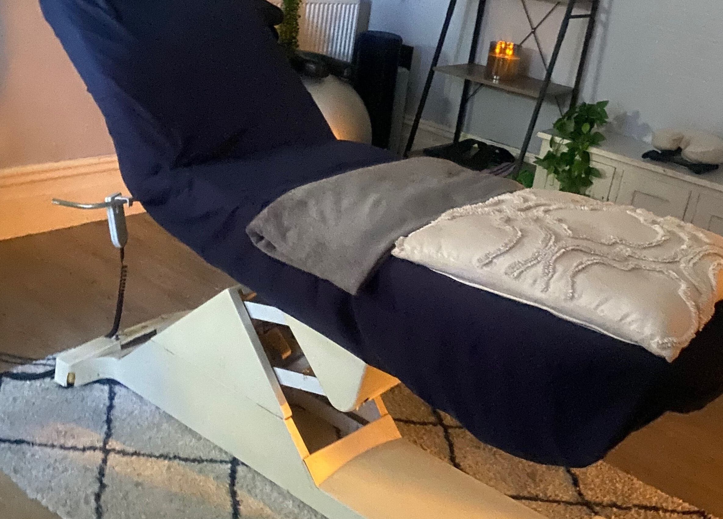 Relaxing massage chair in a cozy room at 1stclass Massage, Sebastopol, Wales, GB.