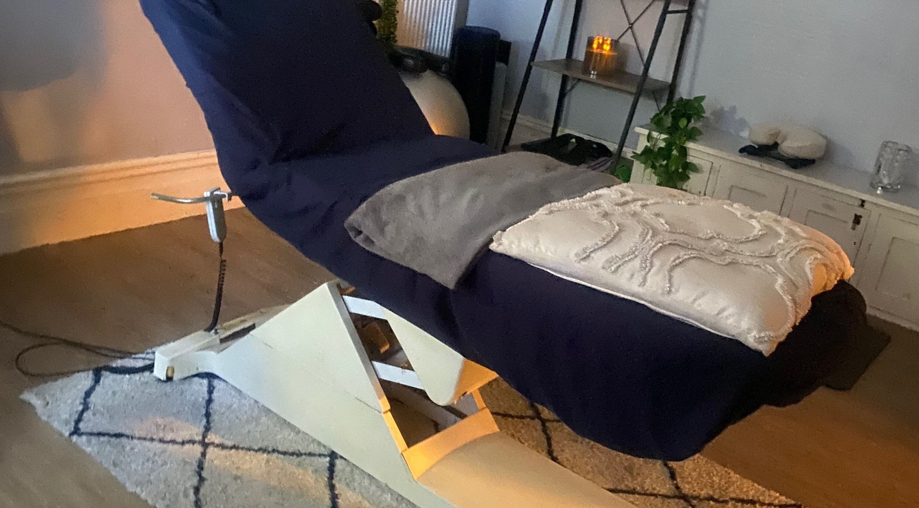 Relaxing massage chair in a cozy room at 1stclass Massage, Sebastopol, Wales, GB.