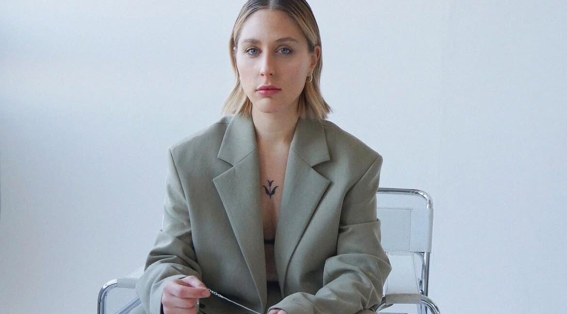 Stylish woman at milenadrwecka.hair, London, England, GB, exuding confident elegance in a sleek design.