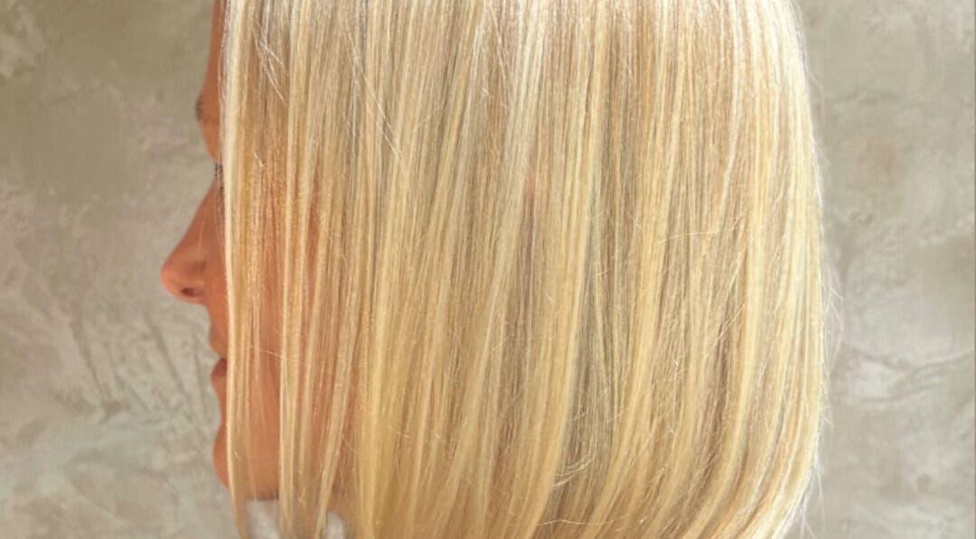 Side view of a sleek blonde bob hairstyle at milenadrwecka.hair, London, England, GB.