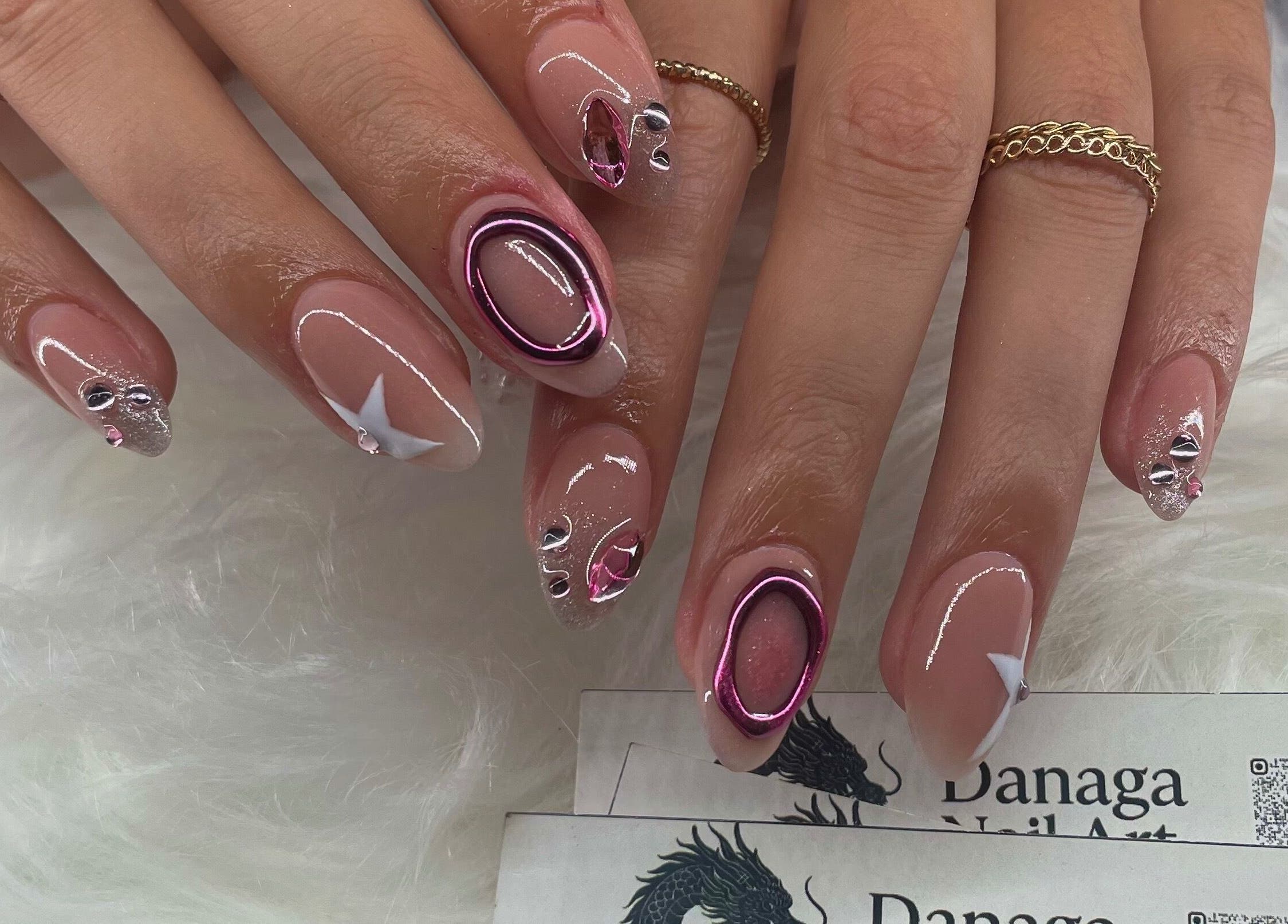 Elegant gel nail art with gemstones at Danaga Studio, Chihuahua, Chihuahua, MX.
