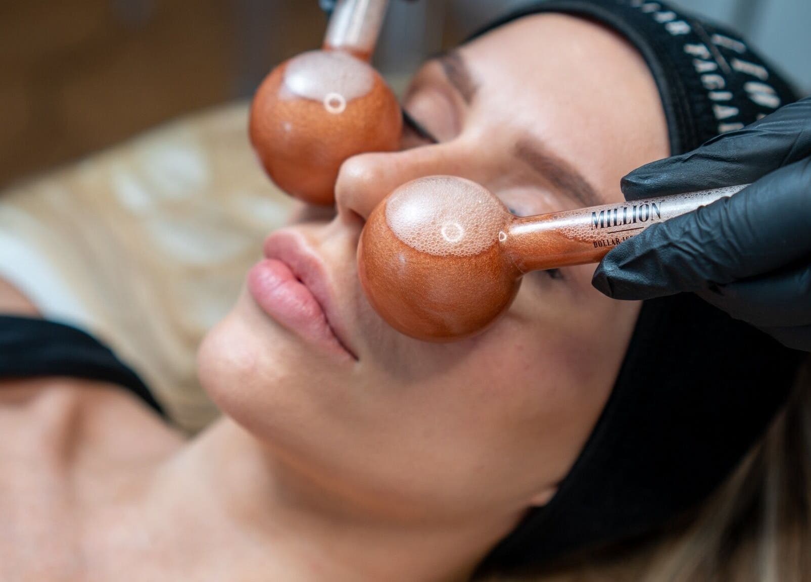 Relaxing spa treatment with cooling globes at Skin by Kate, Blackpool, England, GB, enhancing facial rejuvenation.