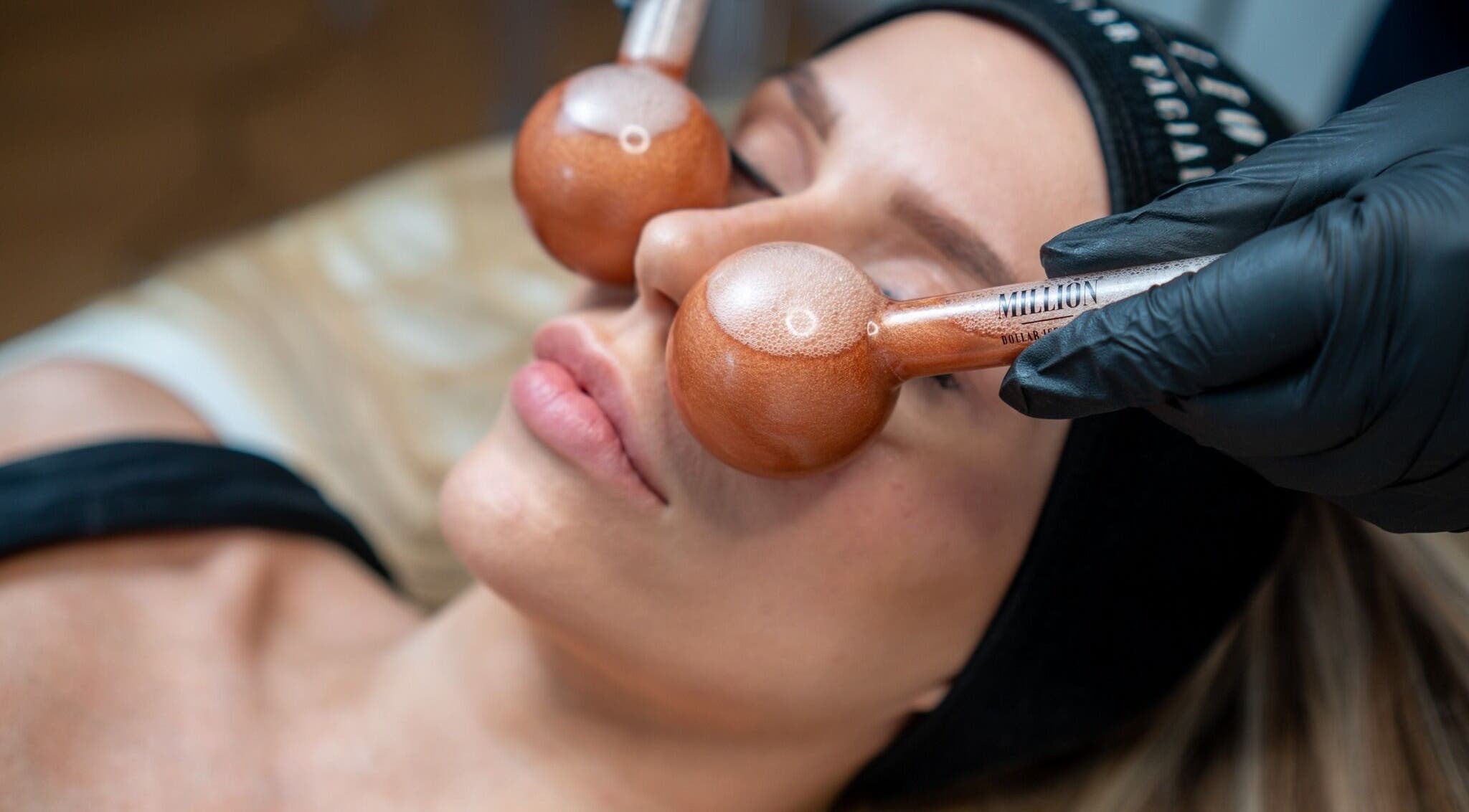 Relaxing spa treatment with cooling globes at Skin by Kate, Blackpool, England, GB, enhancing facial rejuvenation.