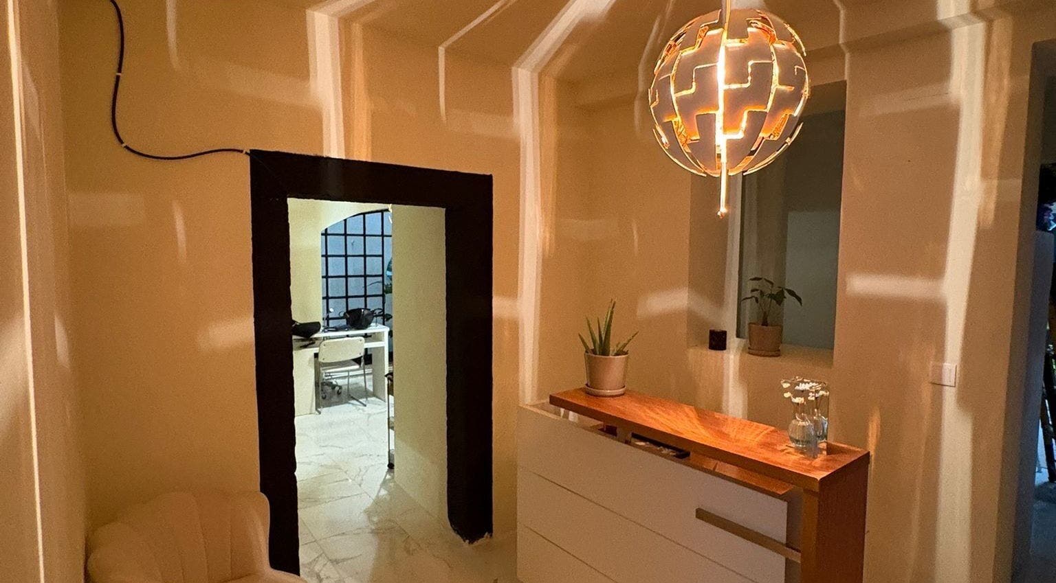 Warm, stylish reception at Ciao Bella, Lisboa, Lisboa, PT with unique lighting and modern decor.