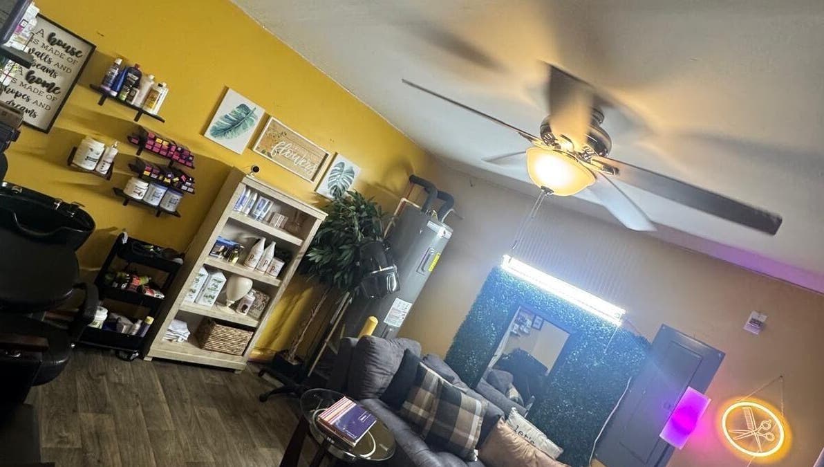 Interior of Kairos Dominican Hair Salon in Dallas, North Carolina, US with stylish decor and warm lighting.