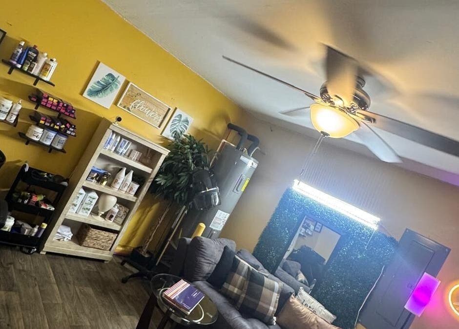 Interior of Kairos Dominican Hair Salon in Dallas, North Carolina, US with stylish decor and warm lighting.