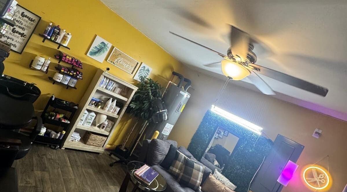 Interior of Kairos Dominican Hair Salon in Dallas, North Carolina, US with stylish decor and warm lighting.