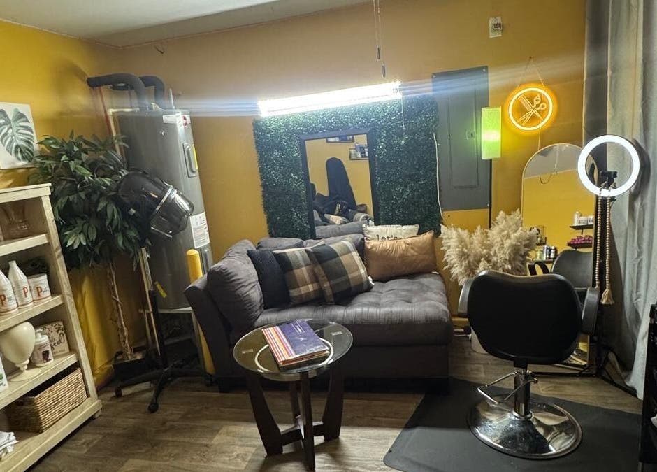 Comfortable seating and styling area at Kairos Dominican Hair Salon, Dallas, North Carolina, US.