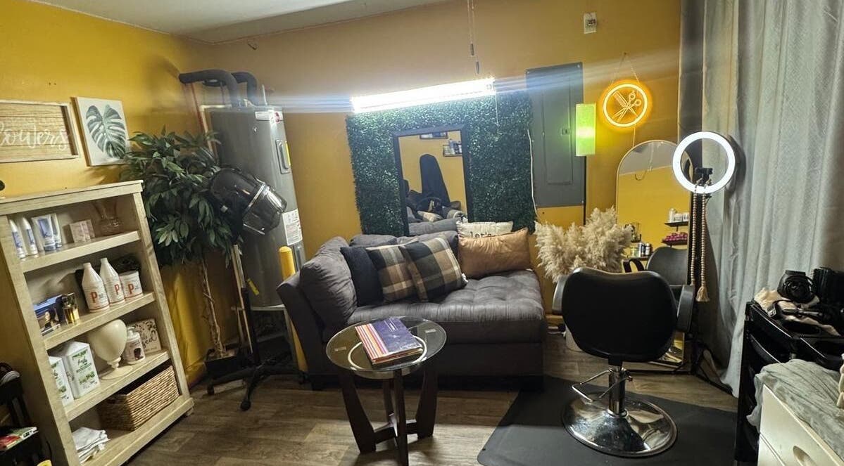 Comfortable seating and styling area at Kairos Dominican Hair Salon, Dallas, North Carolina, US.