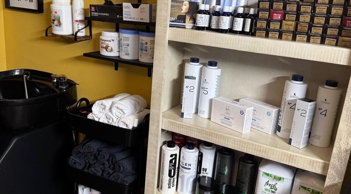 Hair products and towels at Kairos Dominican Hair Salon, Dallas, North Carolina, US.