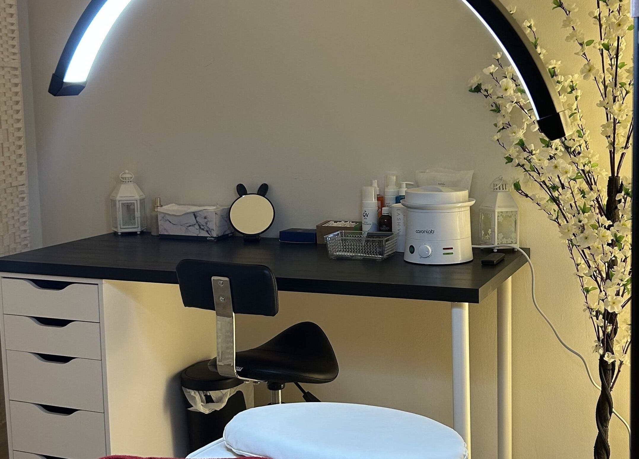 Cozy treatment area at Velvet Touch Brows, Kinross, Western Australia, AU with beauty tools on a sleek desk.