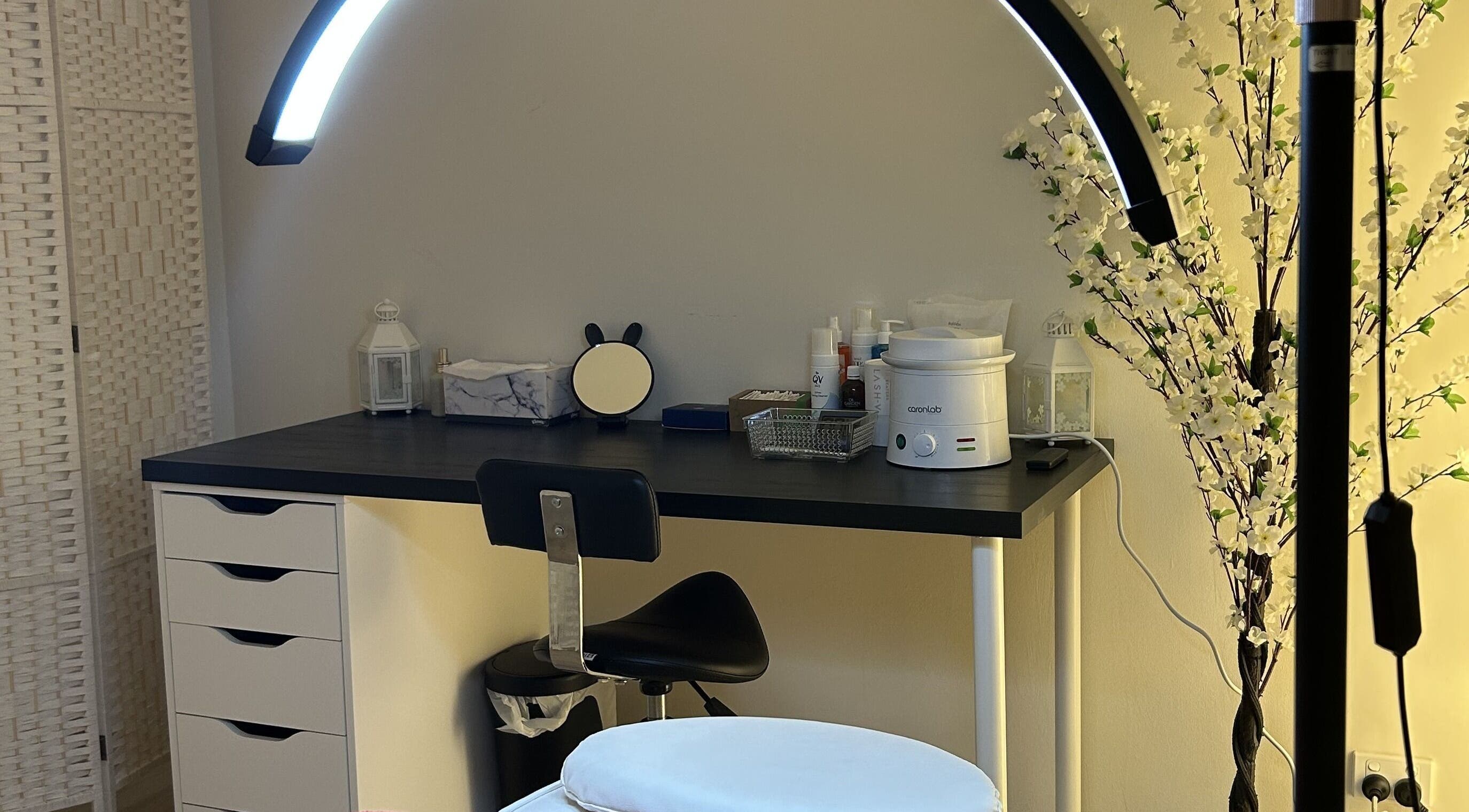 Cozy treatment area at Velvet Touch Brows, Kinross, Western Australia, AU with beauty tools on a sleek desk.
