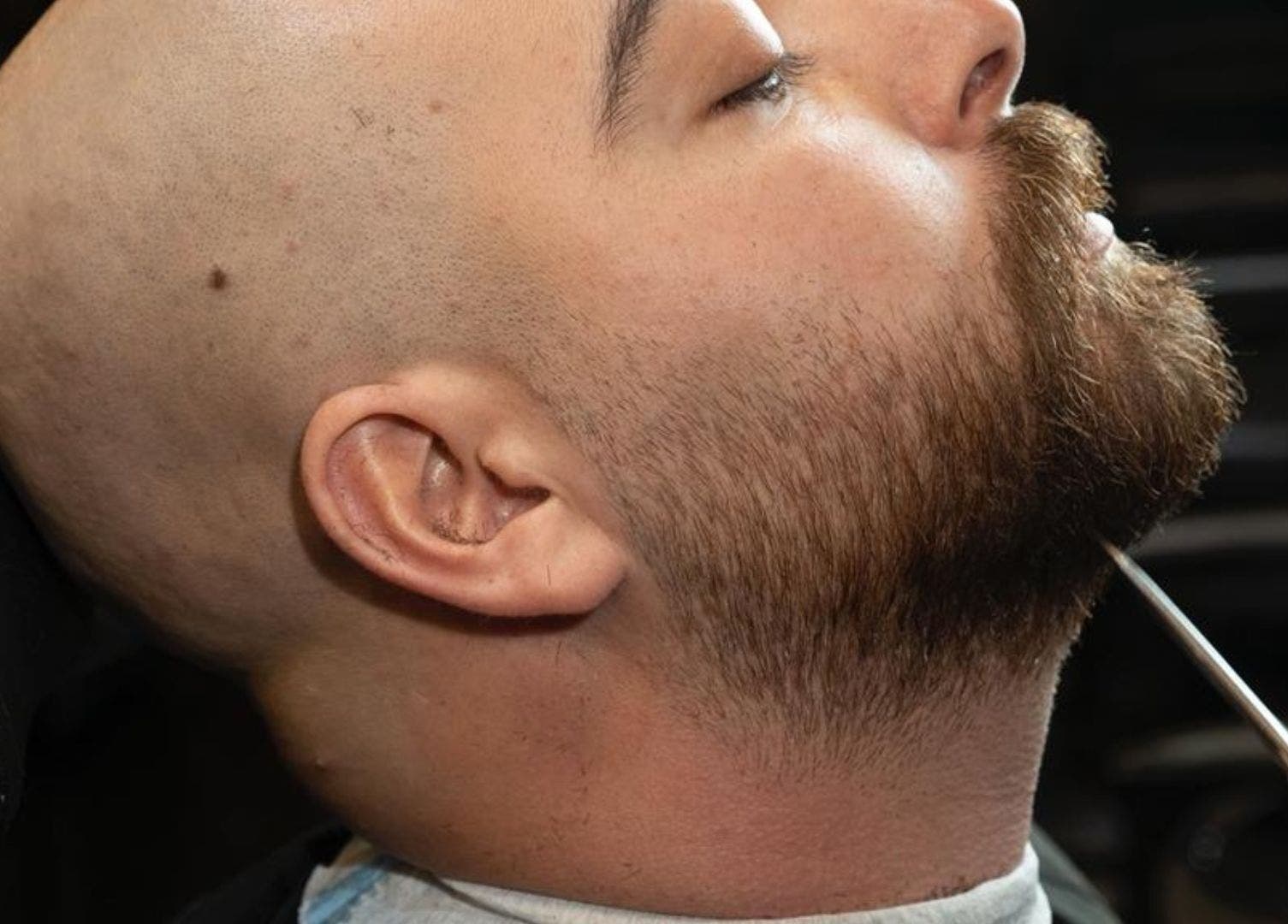 Close-up of a man's beard being trimmed at Excluser Gents Salon L.L.C, Dubai, AE.