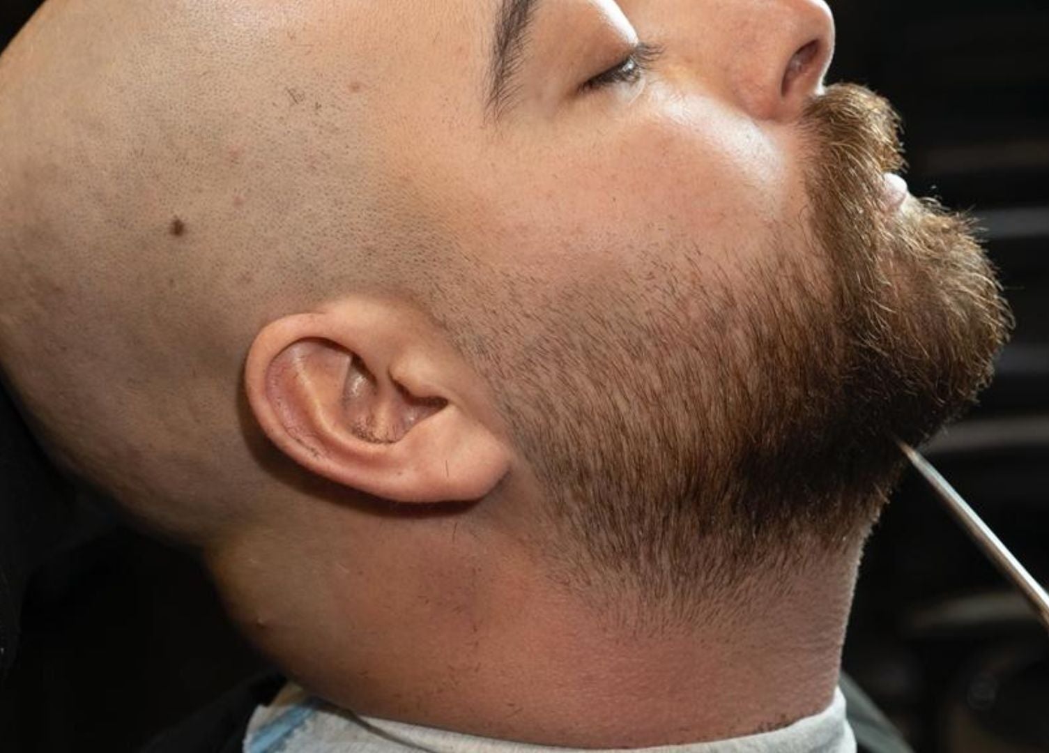 Close-up of a man's beard being trimmed at Excluser Gents Salon L.L.C, Dubai, AE.